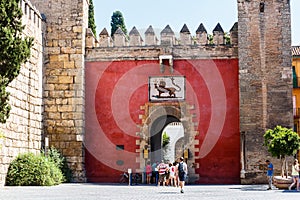 Coat of arms of the Spanish king Pedro I over the Lion's Gate to Alcazar Gardens