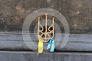 Coat of arms of Ukraine from straw, trident, yellow and blue rib