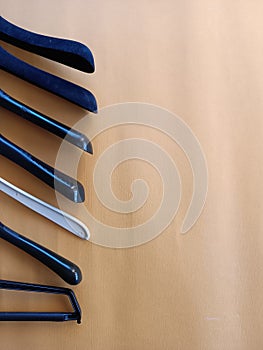 Coat Hanger Leaning On Wood Background