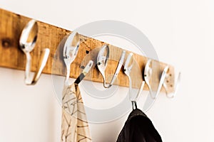 Coat rack made from creatively bent spoons