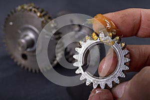 Coating the gears with grease. Accessories and spare parts for industrial machinery