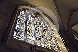 Coats of arms on stained glass window in Chichester Cathedral