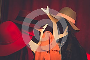 Coats and hat hanging on coat rack