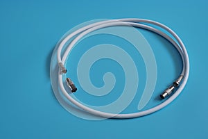 Coaxial cable on a blue background.