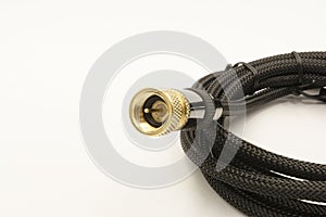 Coaxial cable with golden connector  on white background