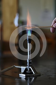 Cobalt solution burning on a wooden splint photo