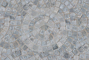 Cobble circular pattern block pavement seamless texture background. Top view