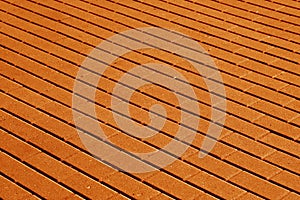 Cobble stone pavement surface pattern in orange tone.