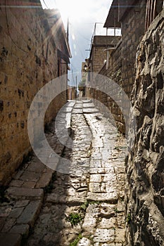 Ancient streets with sunbeam in traditional town Deir el Qamar, Lebanon