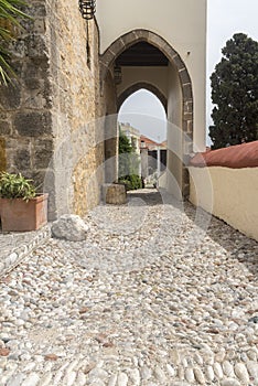 Cobbled path and archway in the old town of Rhodes