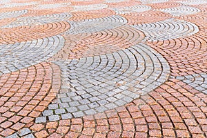 Cobbled pavement of red and gray cobblestone