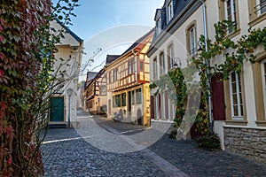 Cobbled road with historic, half-timbered houses in Meisenheim