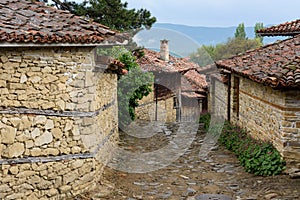 Cobbled road and old traditional houses in Zheravna, Bulgaria