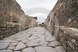 Cobbled street in excavated town of Pompeii, Italy