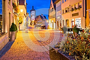 Cobbled street of historic town of Rothenburg ob der Tauber evening view