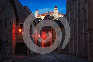 Cobbled Street with Historical Buildings in Old Town at Night