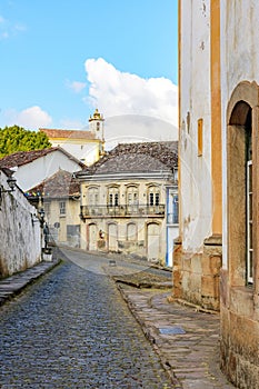 Cobbled streets between baroque churches and colonial style houses