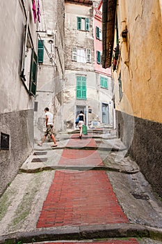 Cobbled uphill narrow street in Ventimiglia