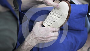 Cobbler glues loafer to its sole