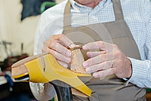 Cobbler mending heel shoe