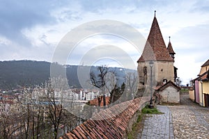 Cobblers` tower, one of the symbols of Sighisoara, on an overcast day in spring. Horizontal framing I