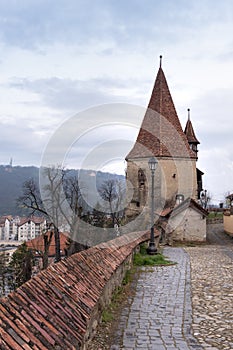Cobblers` tower, one of the symbols of Sighisoara, on an overcast day in spring. Vertical framing II