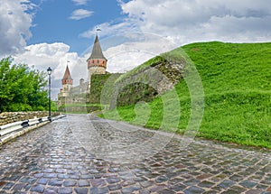 Cobbles road to the Kamianets-Podilskyi fortress after rain, Ukraine