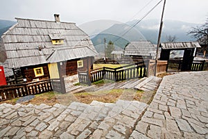 Cobbles street and old style wooden houses