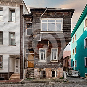 Cobblestone alley, with ruined wooden house, suited in Fatih district, Istanbul