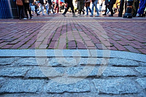 Cobblestone and brick street on Freedom Trail Boston with pedestrians