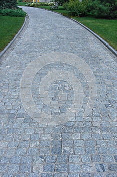 Cobblestone concrete paver estate entryway.