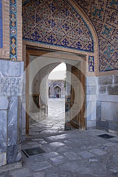 Cobblestone courtyard of madrasa, The Registan, Samarkand, Uzbek