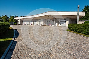 Cobblestone driveway leading to multi-car garage on private estate