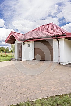 Cobblestone driveway to a beautiful house idea