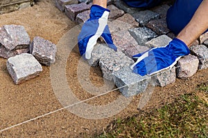 Cobblestone installation - paver laying granite stone pavers