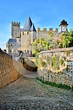Cobblestone lane through the fortress of Carcassonne, France