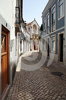 Cobblestone lane in the old town leading up to the Gothic Church of the Grace, Santarem, Portugal