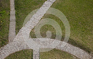 Cobblestone path in grass