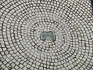 Cobblestone pavement radial pattern with sinkhole