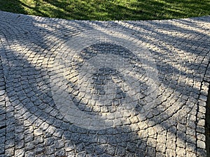 Cobblestone Paving In Perspective With Circular Pattern, Abstract Grey Background Or Texture