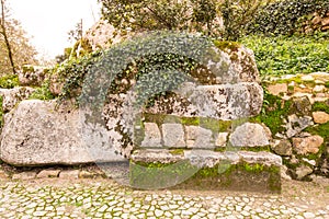 Cobblestone road to the palace foam among the rocks and trees an