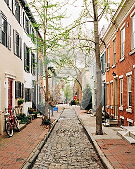 Cobblestone street with brick rowhouses near Filter Square, in Philadelphia, Pennsylvania