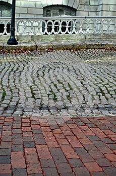 Cobblestone street and brick sidewalk in Portland, Maine, USA, Custom House Street