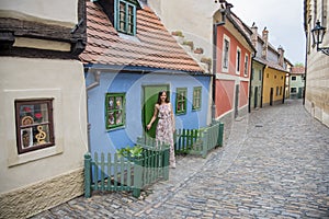 Cobblestone street and colorful 16th century cottages of artisans known as Golden Lane inside the castle walls Prague Czech