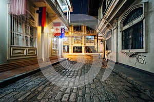 A cobblestone street at night, in Intramuros, Manila, The Philip photo