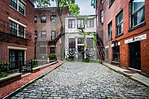 Cobblestone street and old buildings in Beacon Hill, Boston, Mas photo