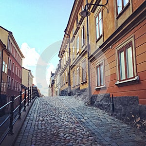 Cobblestone street with old buildings in Stockholm