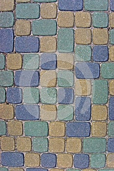 Cobblestone Texture Background Closeup, vertical colorful green, yellow, blue, tan, grey, gray, beige ashlar