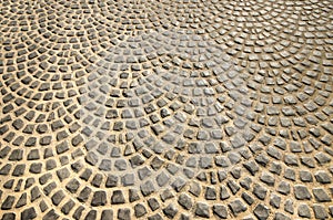 Cobblestoned pavement on floor