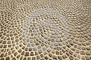 Cobblestoned pavement on floor photo